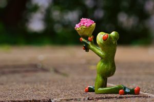 frog with low self-esteem offering flowers to princess