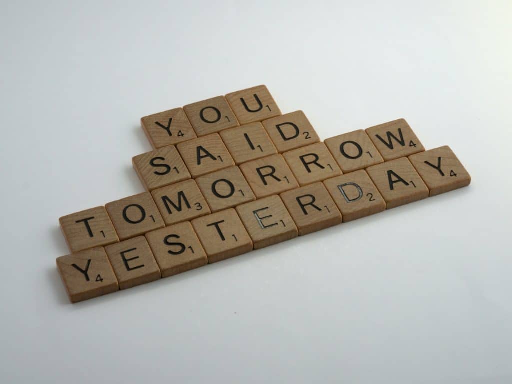 nlp for procrastination. Image of scrabble tiles saying 'you said tomorrow yesterday'