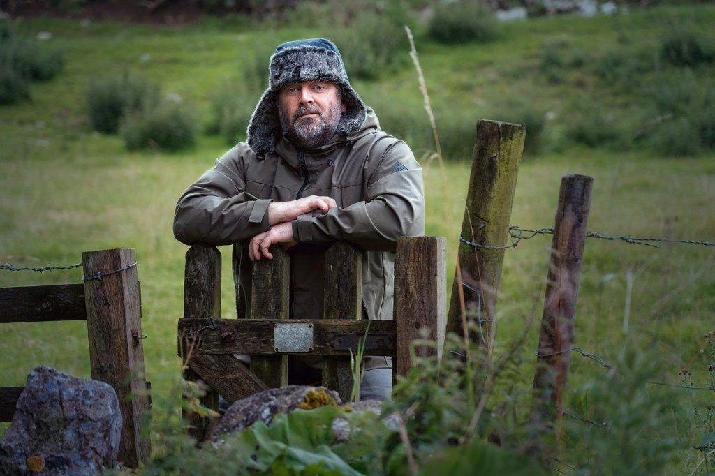 We all need to set boundaries. Man leaning on fence