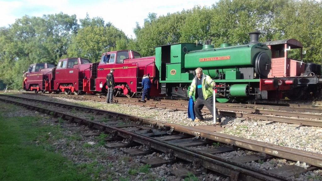 A rake of three Sentinel Diesels and steam locomotive Sir Thoma Royden. 