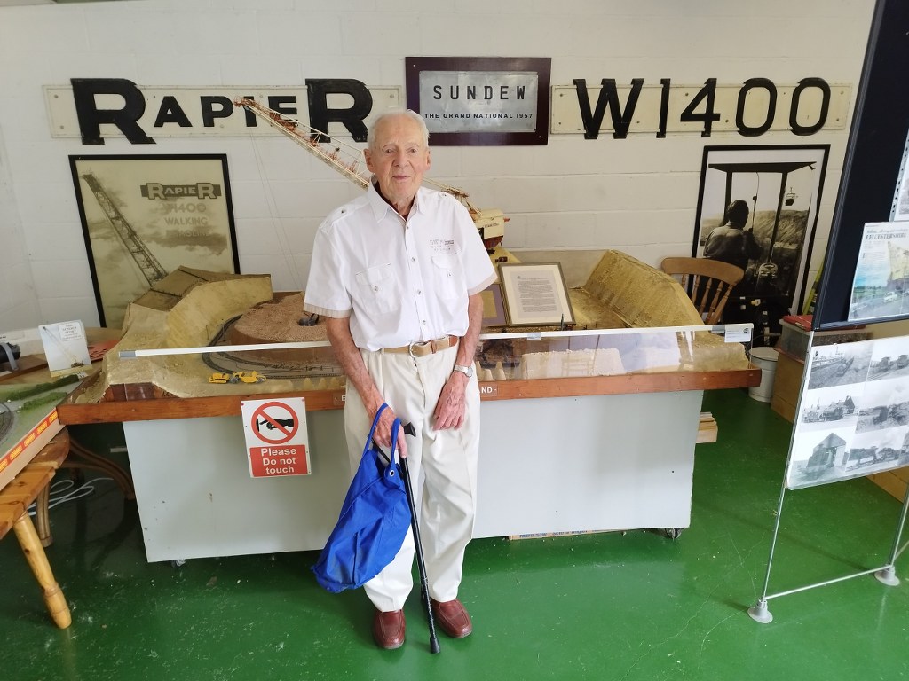 Martin Crowe standing in front of the Museum working Sundew model.