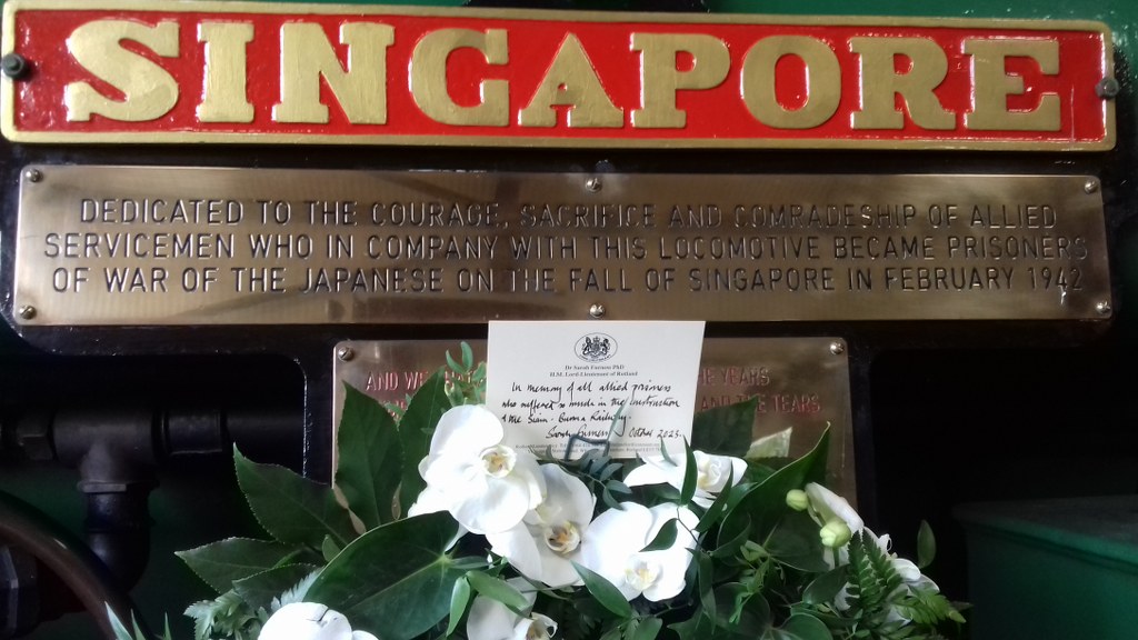 The nameplate for steam locomoteve Singapore which is dedicated to the memory of Far Eastern Prisoners of War. 