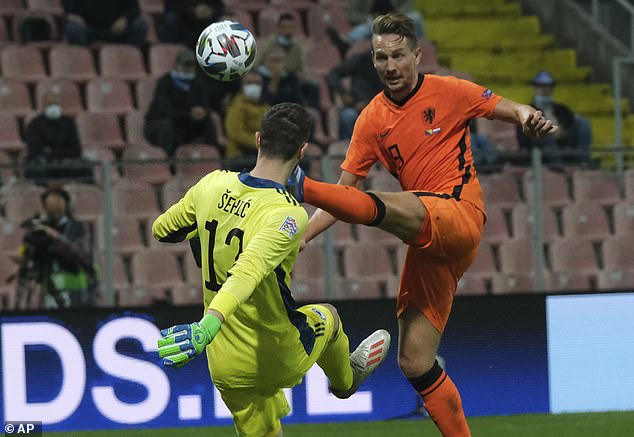 Luke De Jong (right) went close for Holland but was denied by goalkeeper Ibrahim Sehic (left)