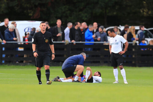 Arron treating Spyros Mentis whilst Ed Asafu-Adjaye looks on - Picture courtesy of Kevin Richards