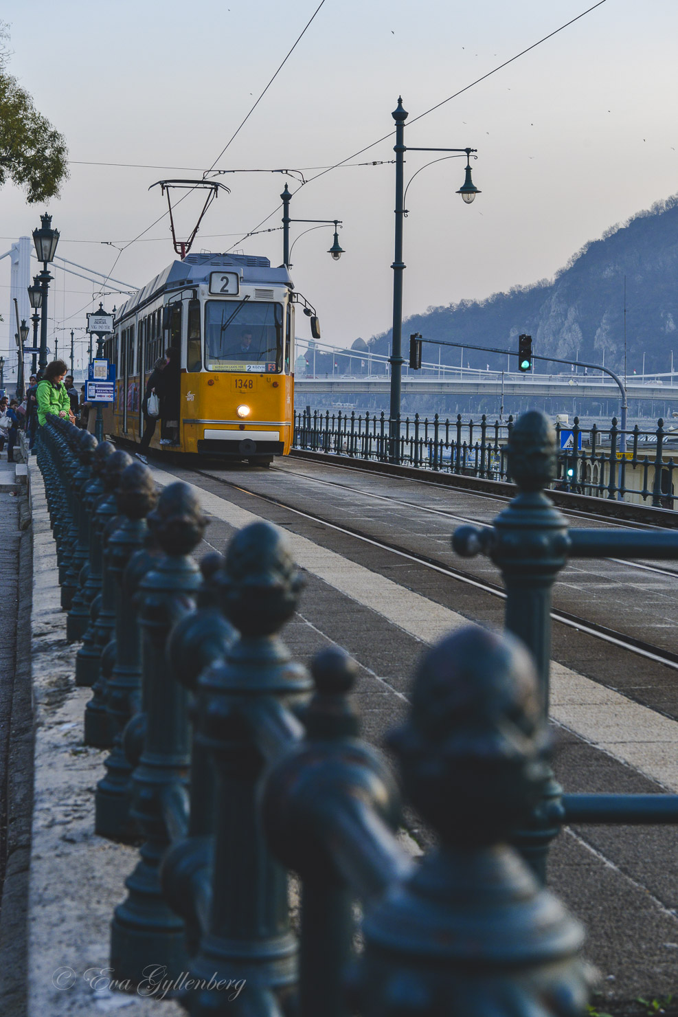 The yellow trams in Budapest next to the Danube