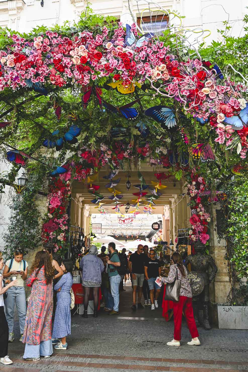The entrance to Gozsdu Udvar with all the flowers