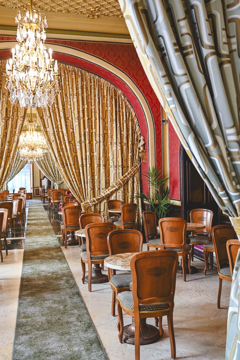 Café Gerbeaud with its large curtains and marble tables