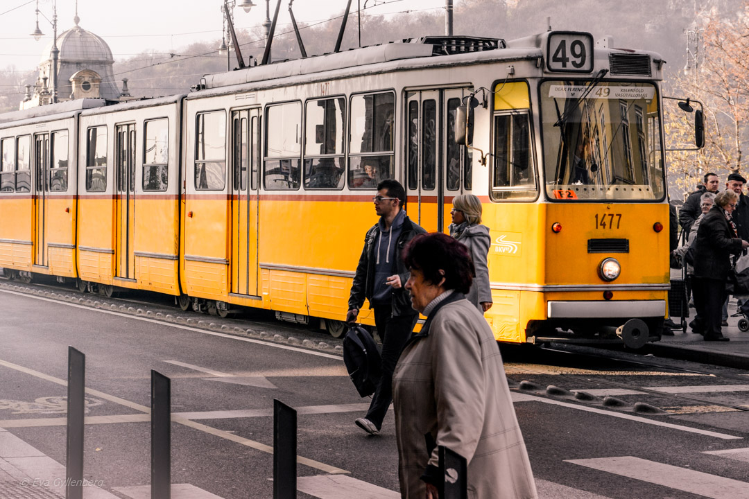 A yellow tram in Budapest in the morning mist