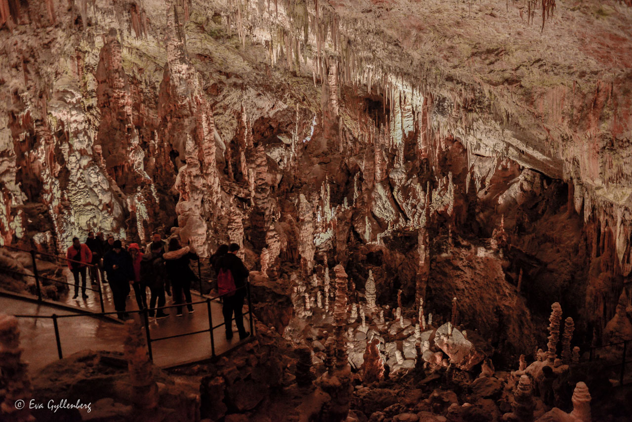 People hiking in Postojna Cave in Slovenia