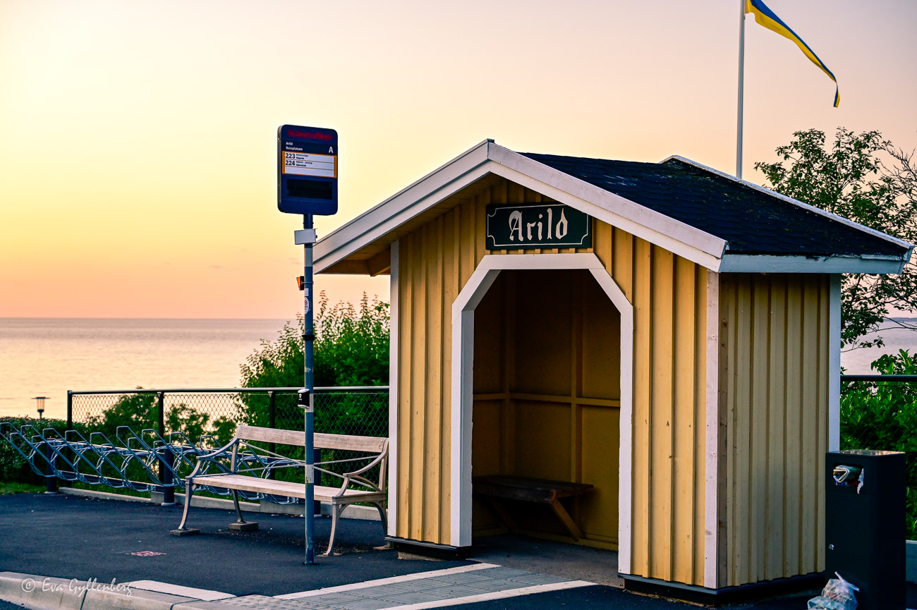 Small bus shelter with Arild sign in Arild