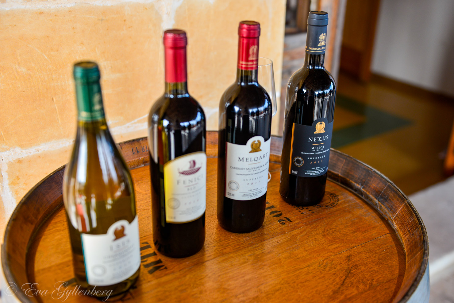 Four wine bottles in a row from the Meridiana winery
