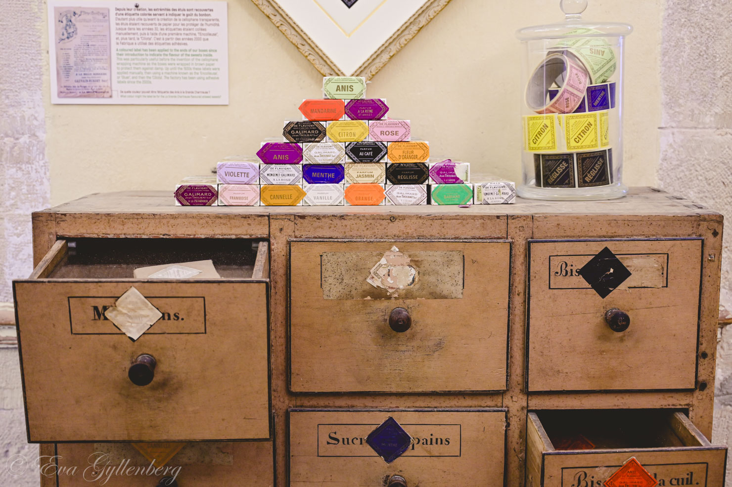 an old chest of drawers with drawers and colorful little boxes