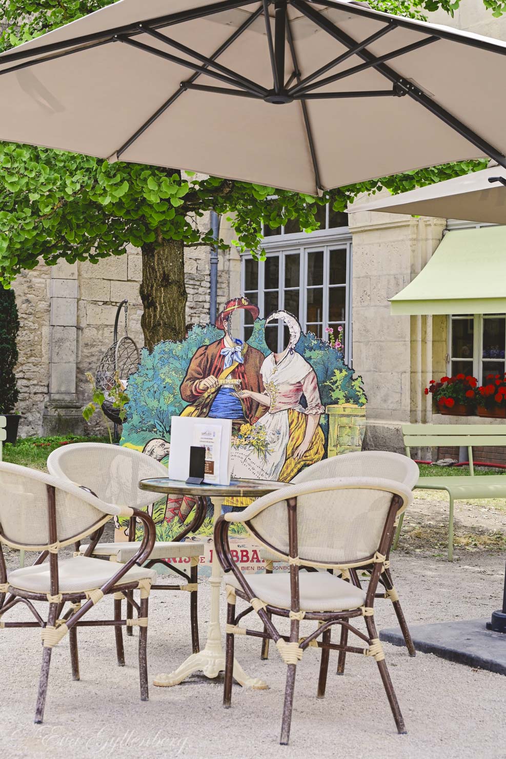 outdoor cafe with parasol and chairs