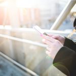 Girl with Smartphone in Sunlights