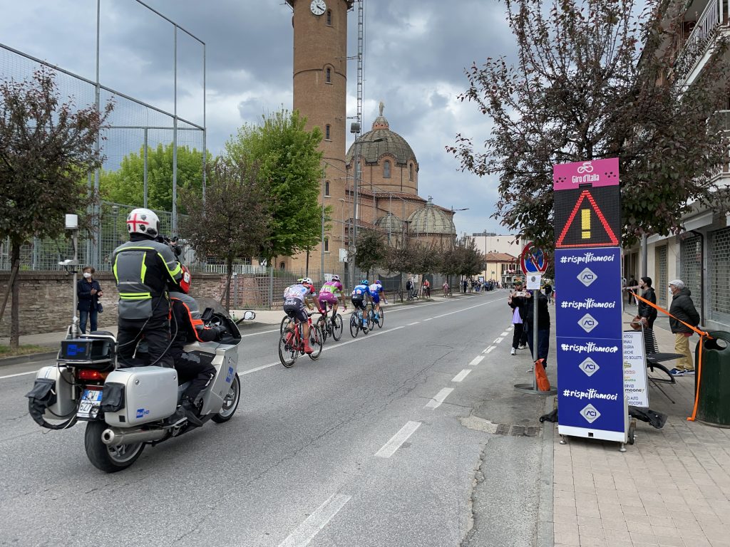 Giro d'Italia 2022 using Safe Cycling Safety Sign (Mobile LED-sign for sporting events) with commercial space for event sponsors.