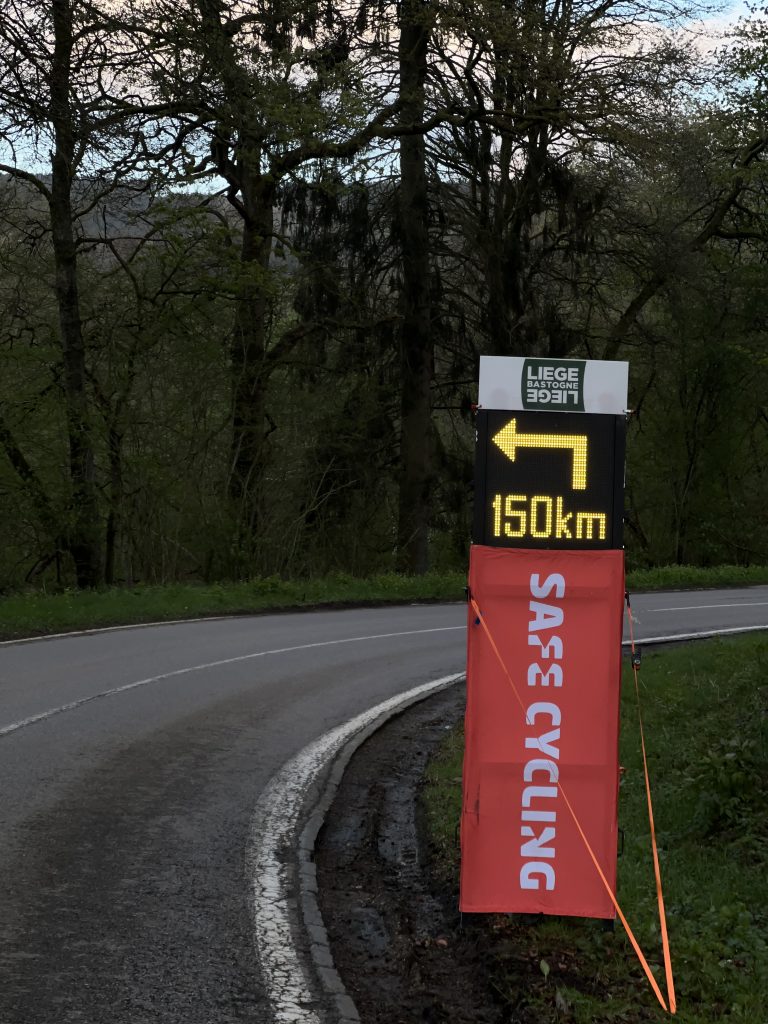 Liège-Bastogne-Liège Challenge 2024 using Safe Cycling Safety Sign (Mobile LED-sign for sporting events) with commercial space for event sponsors.