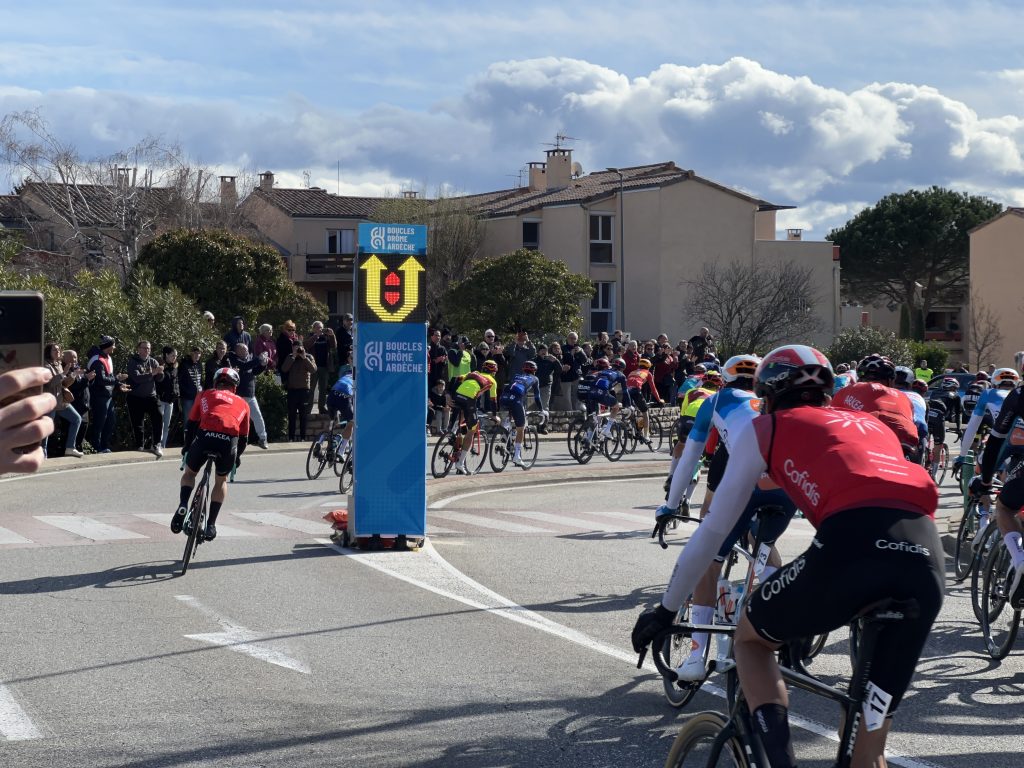 Drôme Classic and Faun-Ardèche Classic 2024 using Safe Cycling Safety Sign (Mobile LED-sign for sporting events) with commercial space for event sponsors.