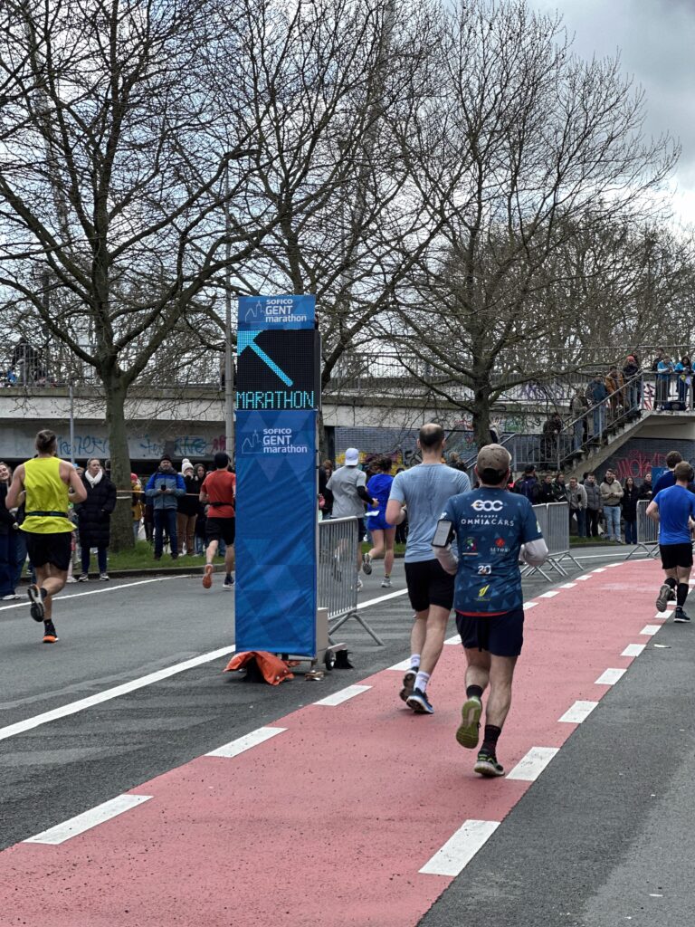 Sofico Gent Marathon 2024 using Safe Cycling Safety Sign (Mobile LED-sign for sporting events) with commercial space for event sponsors.