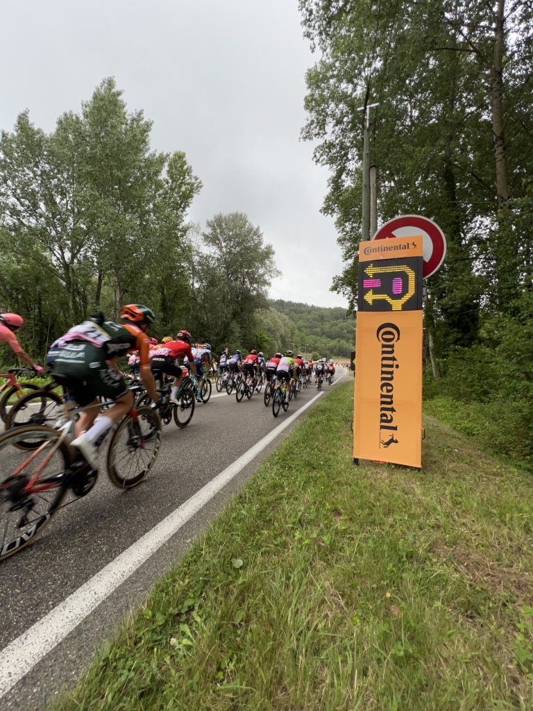 Mobile LED safety sign supplied by Safe Cycling for Tour de France 2024, with commercial space for event sponsors.