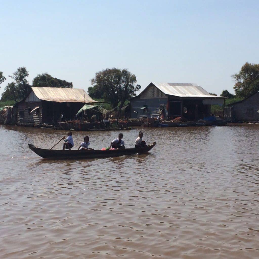 Kids Rowing Boat to School at Mechrey floating village
