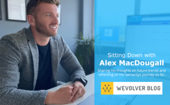 Alex MacDougall sitting at a desk