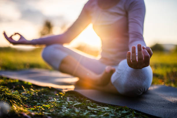 Close up of yoga outdoor at sunset.