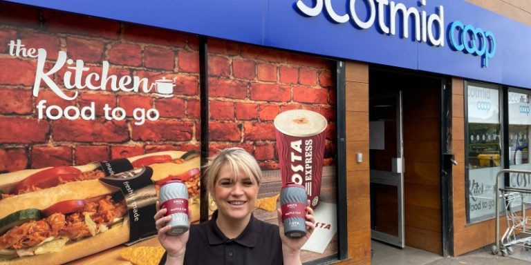 woman holding costa cups