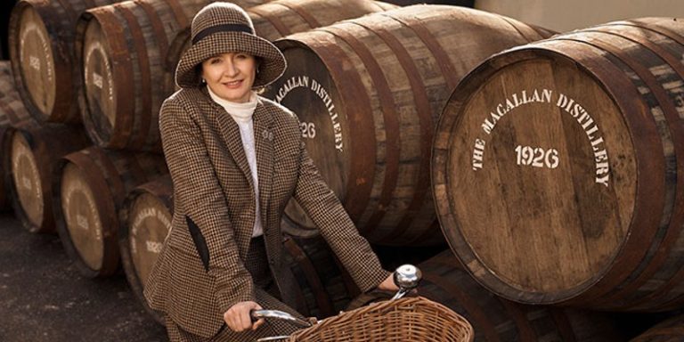 woman amongst whisky barrels
