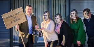 Simon Howie posing with four people masked as R Burns