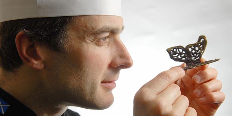 Man looking at chocolate butterfly