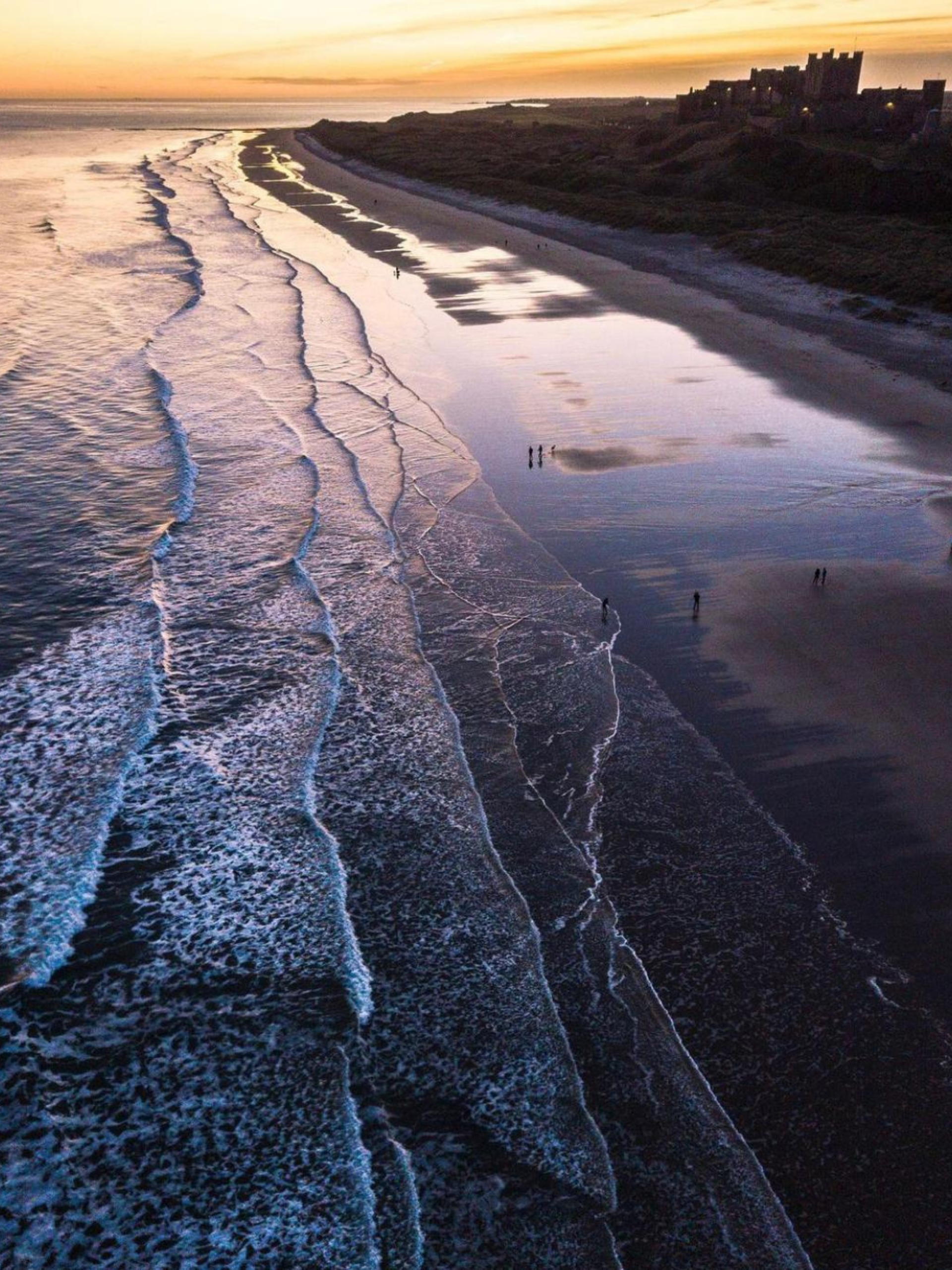 Sunset across Bamburgh Beach in Northumberland