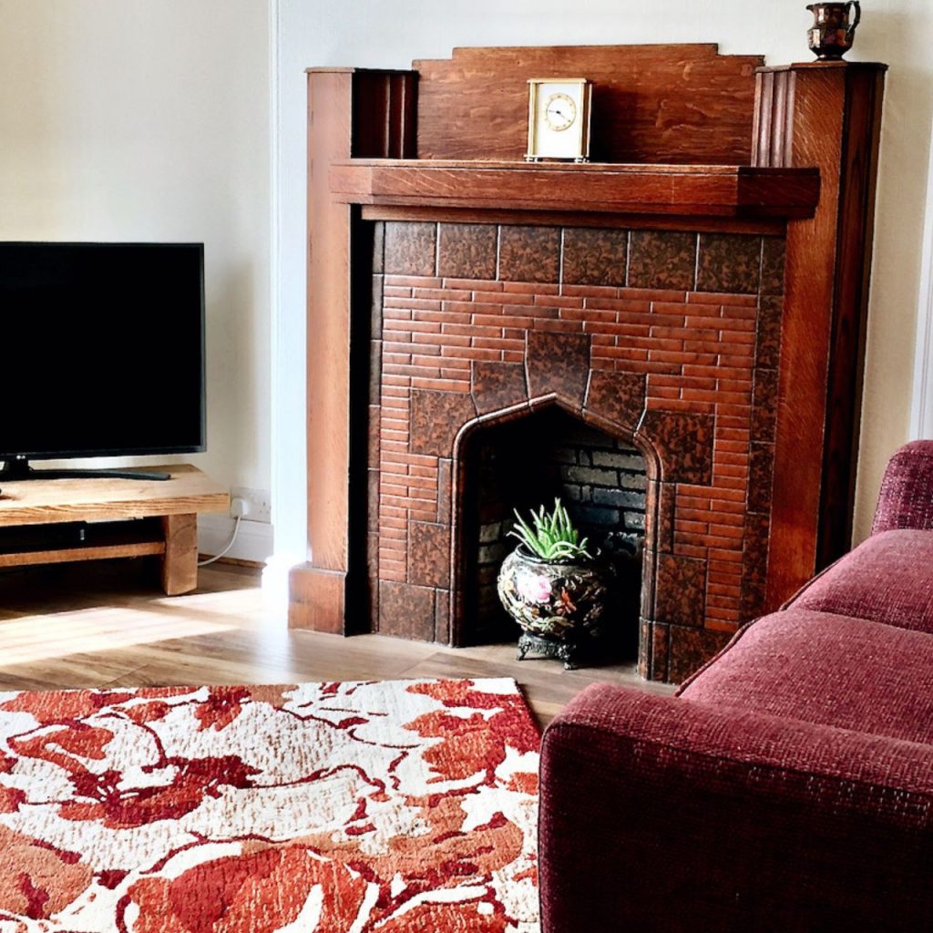 Cosy, cottage living room in Northumberland with fire place centrepeice