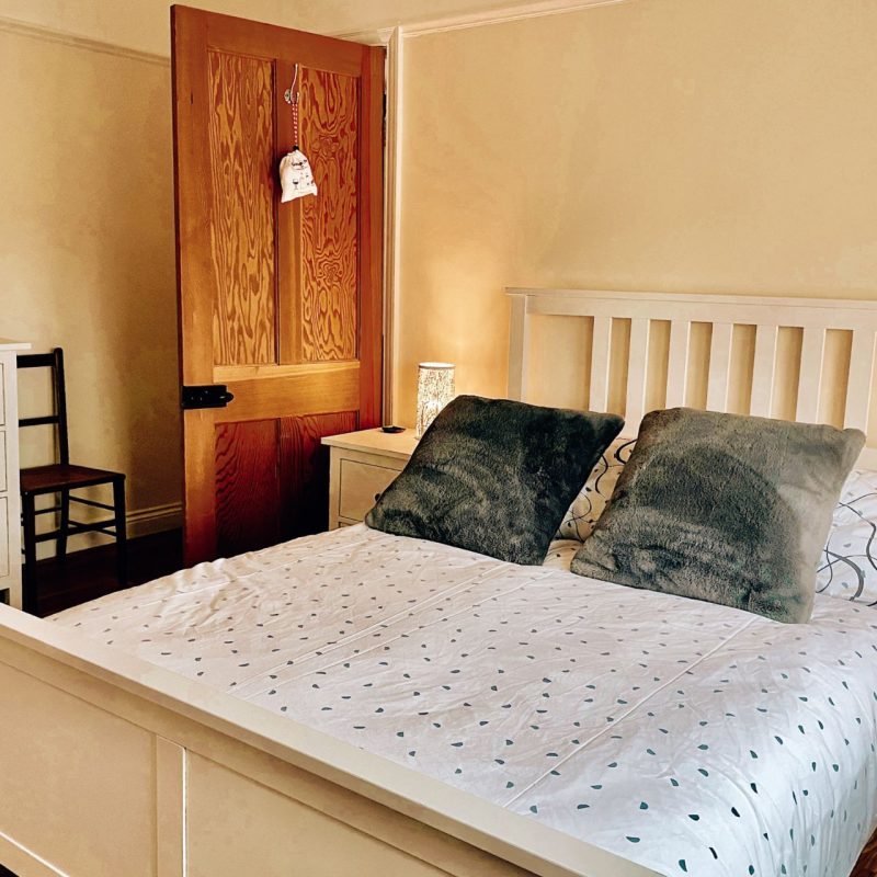 Double bed in country cottage bedroom