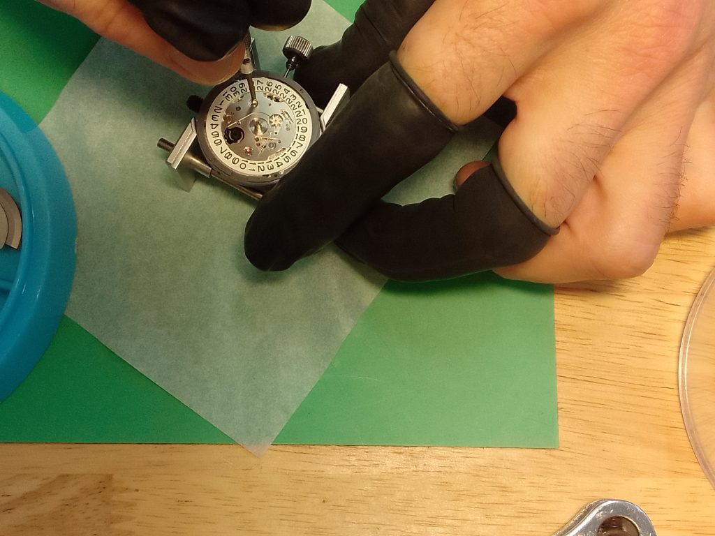 Movements - SKX & 5KX -  removing the screws from the date assembly of a Seiko NH36 / 7S26 with a watchmakers screwdriver - seikomodder.com