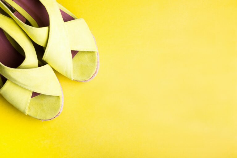 Yellow Platform Sandals on Peper Yellow Background. Flat Lay.