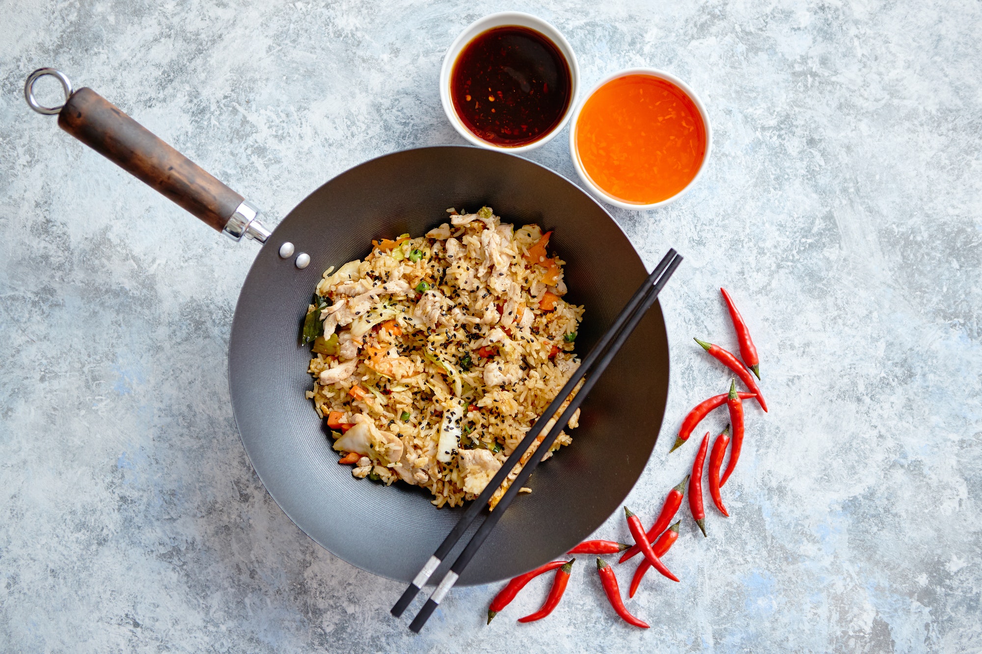 Delicious fried rice with chicken in wok