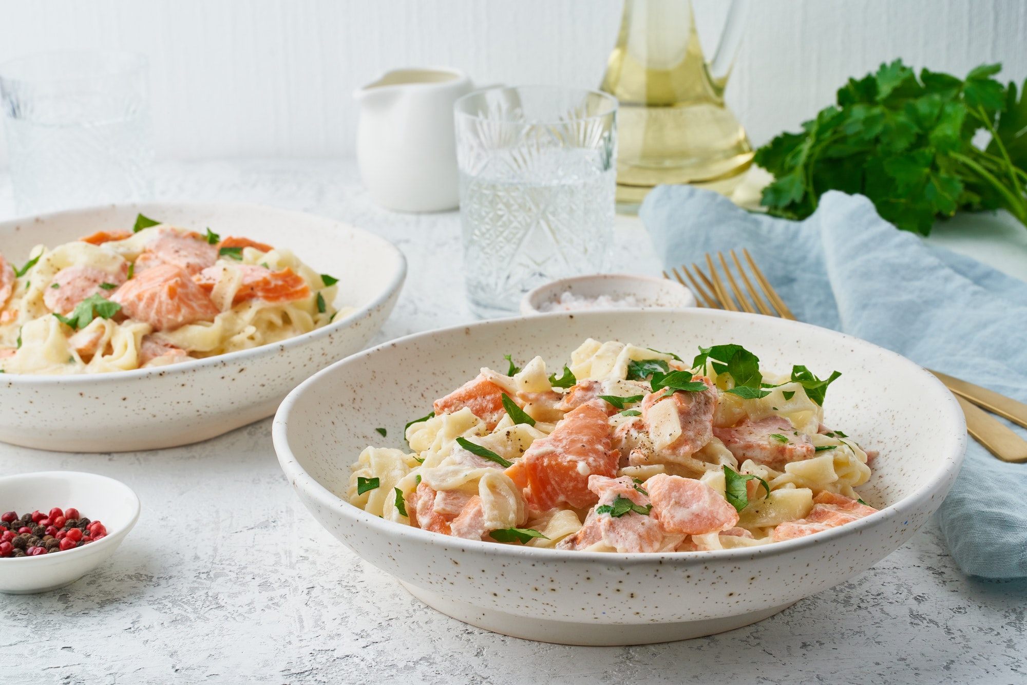 Salmon pasta, tagliatelle with fish and creamy sauce. Italian dinner with seafood