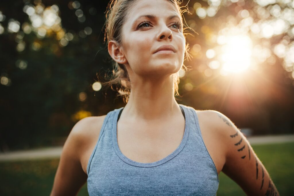 Confident fitness model in park