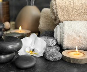 Beautiful spa composition with stones and orchid flower on table Beautiful spa composition with stones and orchid flower on table