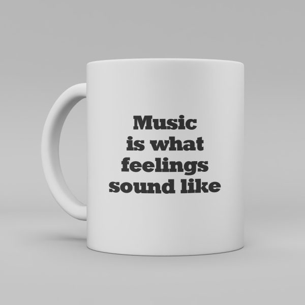 Vit mugg med svart text -Music is what feelings sound like