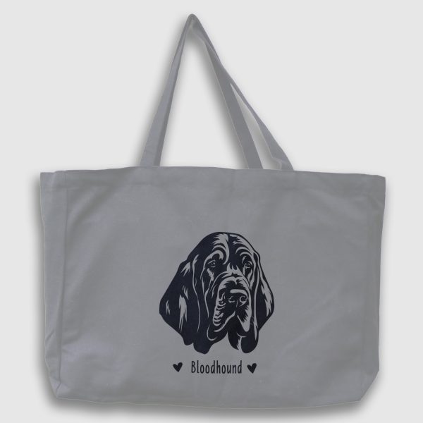 Foto av grå tygväska med svart illustration av hundhuvud av rasen Bloodhound