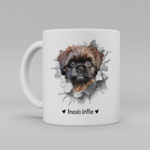 Vit keramikmugg med illustration av ett hundhuvud som "tittar ut genom" ett illustrerat hål. Hunden är av rasen Brussels Griffon