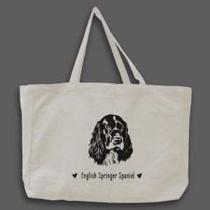 Foto av naturvit tygväska med svart illustration av hundhuvud av rasen English Springer Spaniel