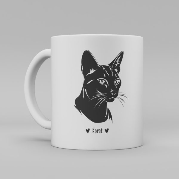 Vit keramikmugg med svart illustration av svart katt av rasen Korat