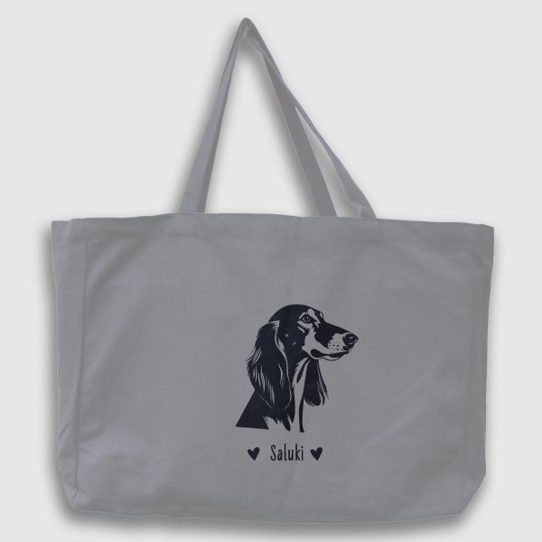 Foto av grå tygväska med svart illustration av hundhuvud av rasen Saluki