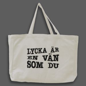 Naturvit tygväska med svart text: "Lycka är en vän som du"