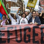 Protesters behind a banner chant as thousands march in central London, declaring that refugees are welcome in the UK Photograph: redorbital/Demotix/Corbis