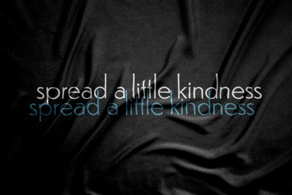 Kindness print on black fabric