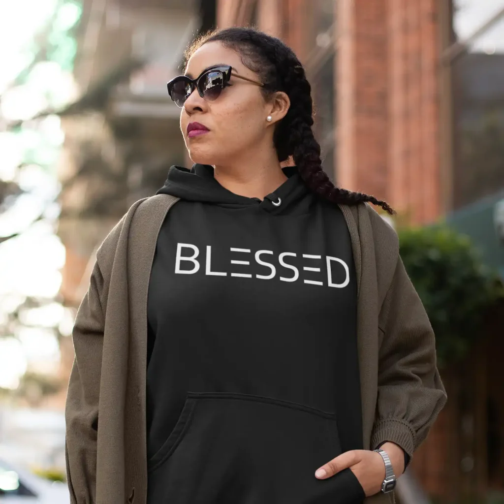 Woman wearing jet black Just Hoods hoodie with Blessed print