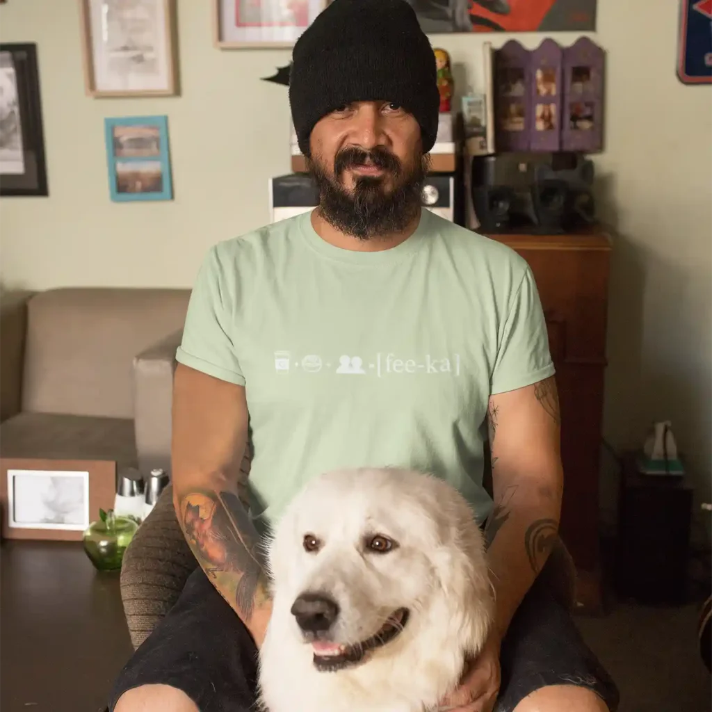 Man wearing a spring green t-shirt with Fika Rebus print